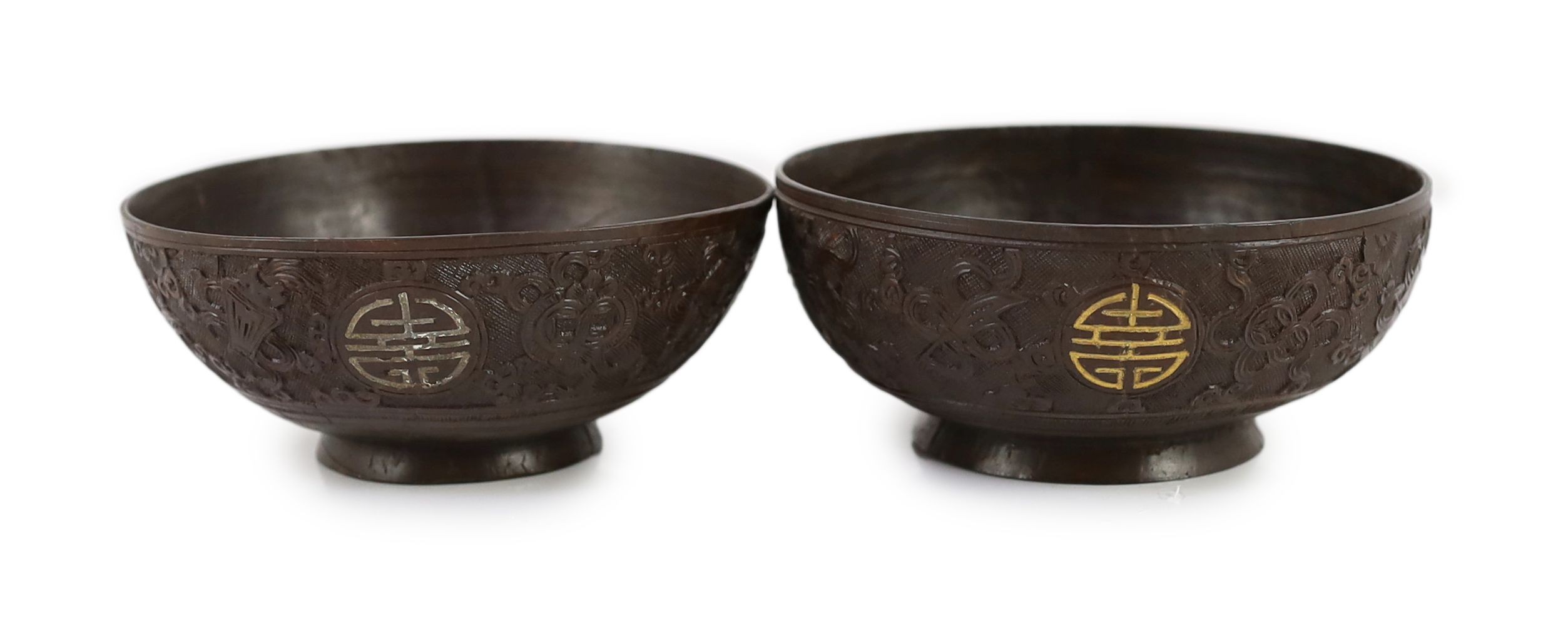 A pair of Chinese coconut bowls, 19th century, Approximately 12 cm diameter